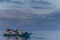 FLORES/INDONESIA- JANUARY 04 2014: A pair of fishermen are running like in the sea of Ã¢â¬â¹Ã¢â¬â¹Flores. They greet friendly from the